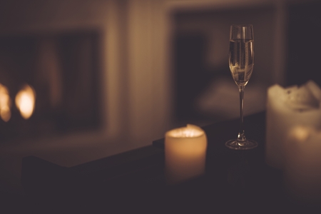 Champagne Glass on the Piano. Romantic Theme with the Champagne and Candles.の写真素材