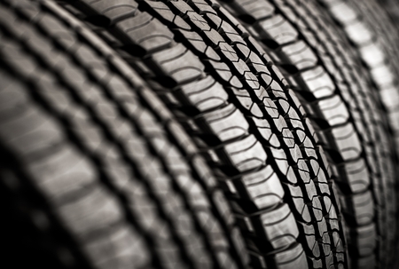 Brand New Tires For Sale. Car Tires Row on a Rack.