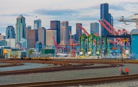 Port of Seattle District Cargo Ships Lifts, Railroad Tracks and the Seattle Skyline. Seattle, Washington, United States.のeditorial素材
