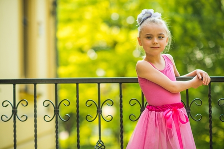 Little Girl in Pink Dress. Seven Years Old Caucasian Girl Ballet Dancer.の写真素材