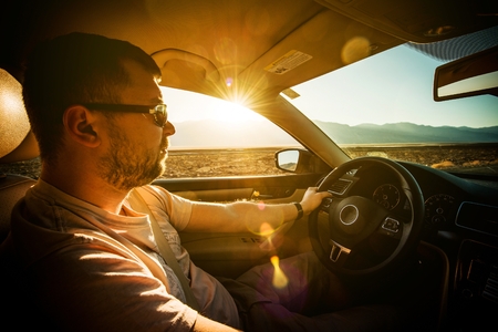 Crossing Southern California Desert by Car. Young Driver on the Journey.の写真素材