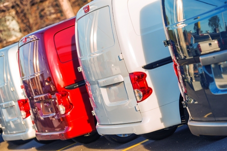 Small Cargo Trucks Business Fleet. Cargo Cars in a Row. Distribution, Shipping and Logistic Business.の写真素材