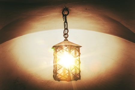 Burning Vintage Lantern. Vintage Color Grading Photo.の写真素材