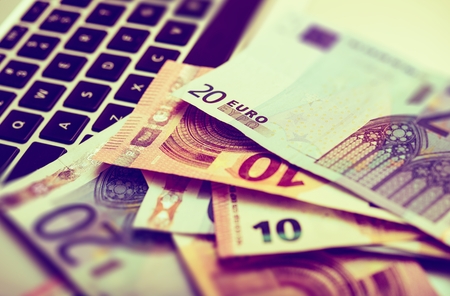 Laptop Keyboard and Euro Billsの写真素材