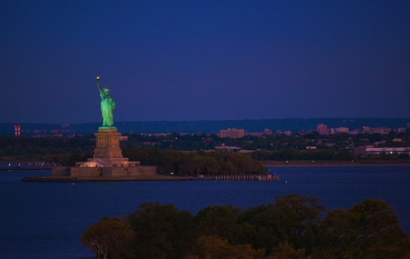 New York Statue of Liberty at Night. Liberty Island in New York Harbor in New York City, United States of America.の写真素材