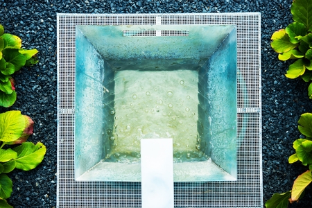 Decorative Garden Elements. Small Square Metallic Garden Fountain.の写真素材