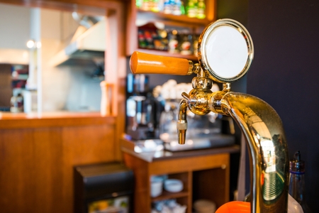 Golden Bar Beer Tap Closeup Photo. Pub Equipment.の写真素材