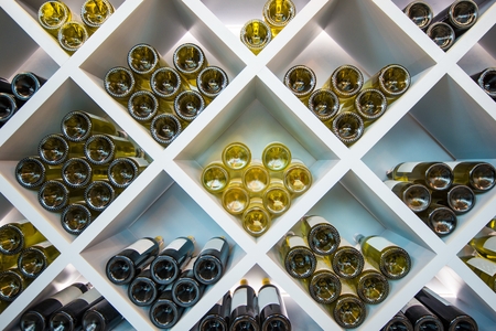 Wines White Wooden Shelve in Wines Cellar. Wines Selection.の写真素材