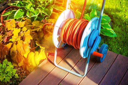 Garden Watering by Garden Hose. Gardening Equipment.