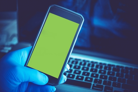 Medical Mobile Application Concept with Green Screen Display For Easy Incorporation Custom Screen. Smartphone in Doctor Hand.の写真素材