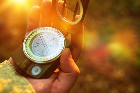 Hiking with Small Compass Device. Compass in a Hand.の写真素材