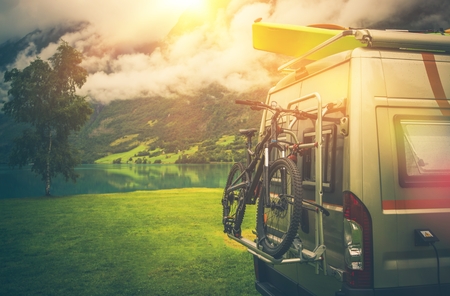 Camper Trip Adventures. Modern Camper Van Motorcoach with Bike and Kayak.の写真素材