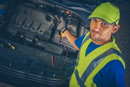 Satisfied Car Mechanic with Broken Car. Mechanic Proceed with Car Maintenance. Auto Service Theme.の写真素材