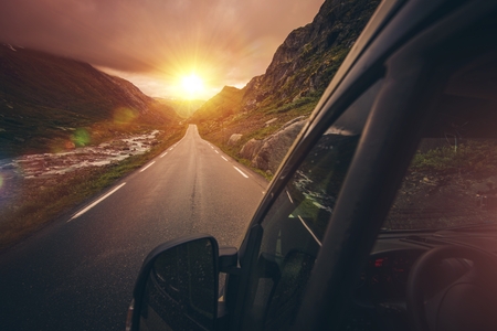 RV Motorhome Traveling. Scenic Mountain Route with Sunset. Summer Camper Trip.の写真素材