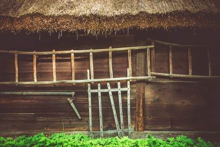 Vintage Wooden House Closeup Photo. Central European Ancient Architecture. Old Wood Logs Home.の写真素材