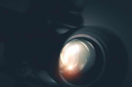Professional Camera Optic Closeup Photo. Videography Theme.