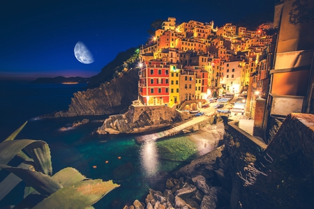 Colorful Italian Illuminations and Reflections. Riomaggiore Village at Night. La Spezia Region. Liguria, Italy.
の写真素材
