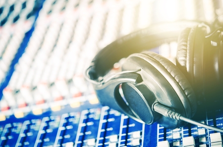 Recording Studio Headphones on the Audio Mixer Board. Closeup Photo. Music and Show Business Concept.の写真素材