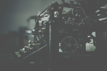 Aged Typewriting Machine Side View. Typewriter Photo Background.の写真素材