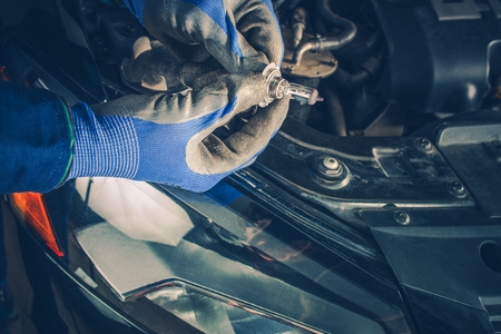 Headlight Bulb Repair and Maintenance in the Auto Service. Maintaining Car Lightning. Repair Vehicle Concept.の写真素材