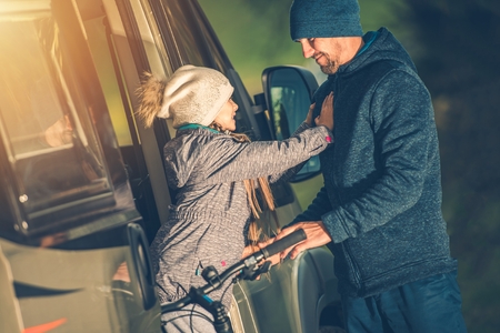Father with Daughter Living Camper Van and Having Fun. Family Life. Caucasian Models.の写真素材