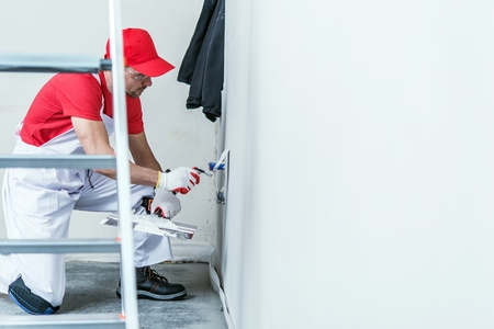 Wall Preparing For Painting. Drywall Patching. Apartment Remodeling Concept Photo.の写真素材