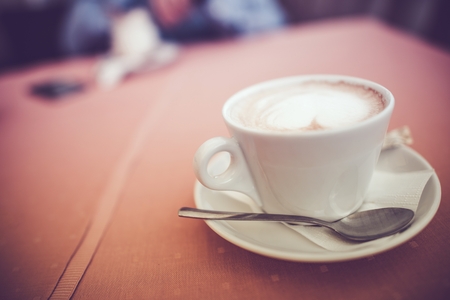 Cup of Cappuccino Coffee with Shallow Depth of Field. Hot Coffee Drink.の写真素材