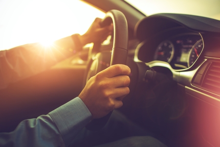 Car and the Driver. Summer Sunset Trip. Modern Car Interior.