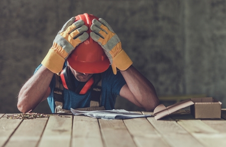 Disappointed Sad Caucasian Contractor Worker Facing Legal Problems. Bond, Insurance, Work Injury Concept Photo.