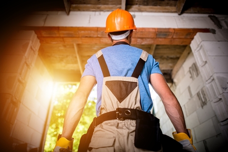 Pro Builder Ready For Work. Building a New House Concept Photo. Caucasian Construction Worker in Orange Hard Hat.の写真素材