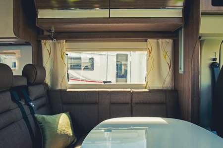 RV Camper Van Elegant Dinette Area. Camping and Traveling Concept.の写真素材