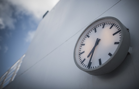 Cruise Ship Time Change Concept. Ship Deck Outdoor Clock Closeup.の写真素材