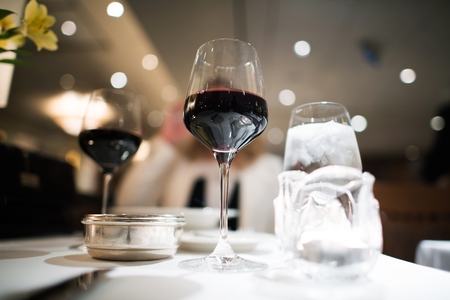 Fancy Dinner with Glass of the Red Wine. Restaurant Table.の写真素材