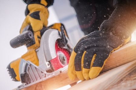 Lumber Woodwork Tools. Wood Construction. Circular Saw in Action.の写真素材
