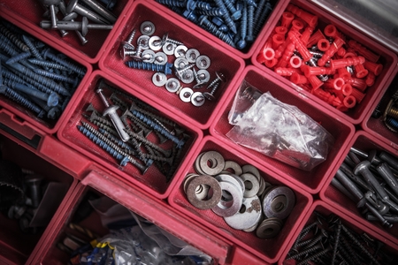 Construction Bolts, Washers and Screws Red Toolbox Closeup.の写真素材