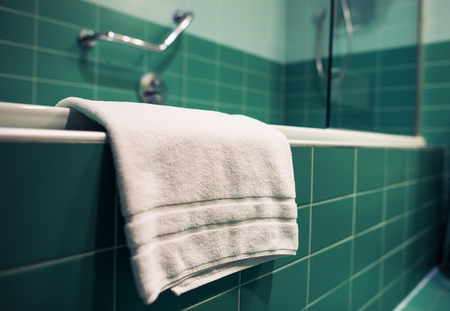 Fresh White Towel in the Greenish Bathroom. の写真素材