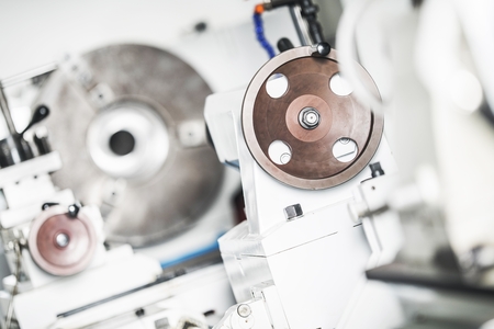 Modern Metal Lathe Machine Adjustment Wheel Closeup with Shallow Depth of Field. Matalworking Machinery.の写真素材