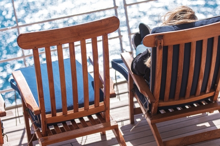 Sea Travel Vacation Relax. Woman Taking Sun on the Cruise Ship Deck.の写真素材