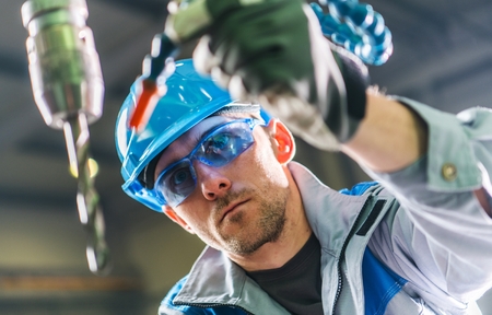 Drilling Technician at Work. Metalworking Theme