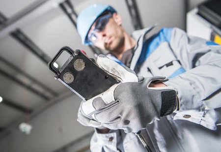 Heavy Duty Industrial Machinery Operator Worker with Cable Remote.の写真素材