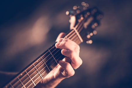 Learning Acoustic Guitar. Hands on the String Instrument Closeup Photo.の写真素材