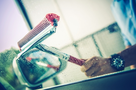 Driver Removing Water From Car Window. Vehicle Cleaning.の写真素材