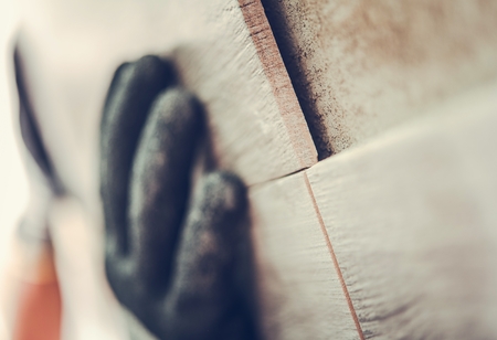 Bathroom Tiles Installer Adjusting Ceramic Elementsの写真素材