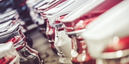 Automotive Industry Cars Stock. Row of Brand New Vehicles on the Dealer Parking.