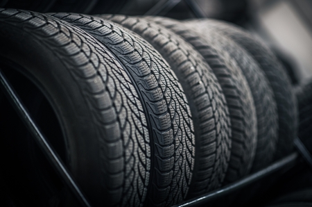 New and Used Car Tires on the Store Rack. Automotive Service.