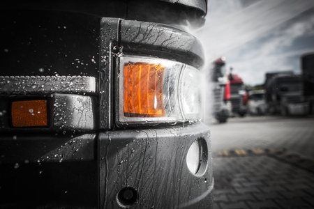 Pressure Washing of Euro Semi Truck Closeup Photo. Trucking Theme.の写真素材