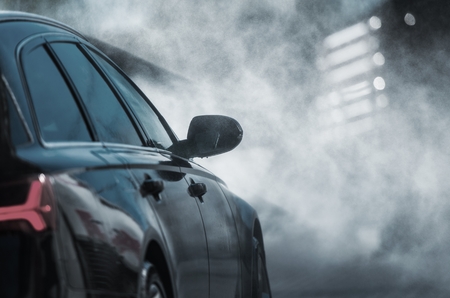 Car in the Washing Station. Cleaning Modern Vehicle Using Pressure Washer.の写真素材