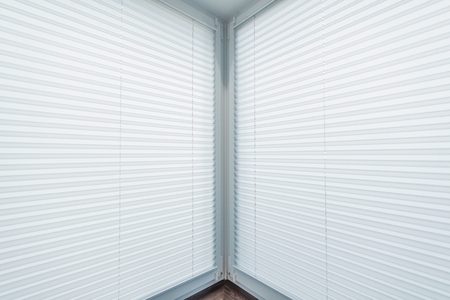 Brand New White Blinds in the Apartment Corner Windows.の写真素材