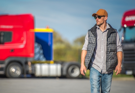 Caucasian Trucker in His 30s and the Truck Stop. Transportation Industry.の写真素材