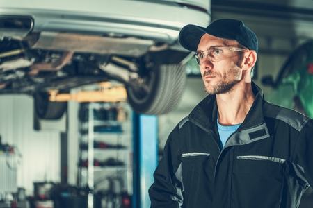 Caucasian Automotive Mechanic in His 30s. Auto Service Center.の写真素材